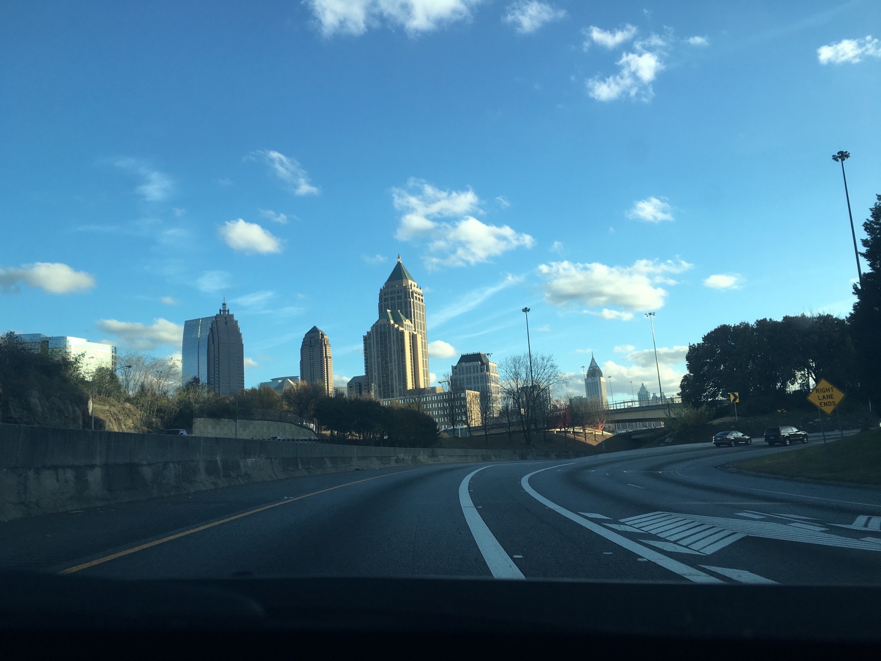 Midtown Atlanta skyline beneath a bright blue sky