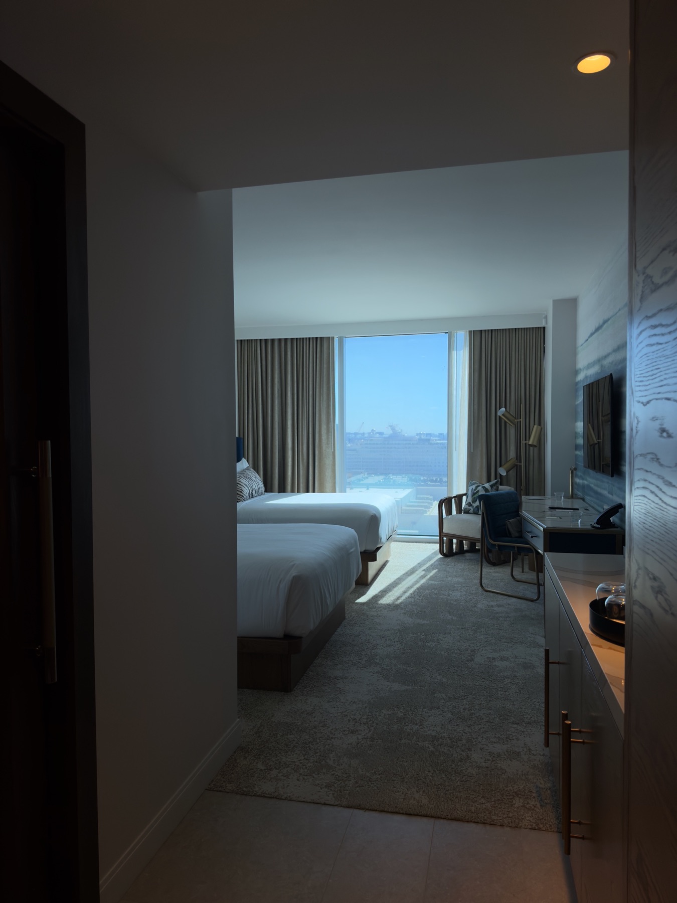 Courtney's photo of a sunlit hotel room ready for arrival